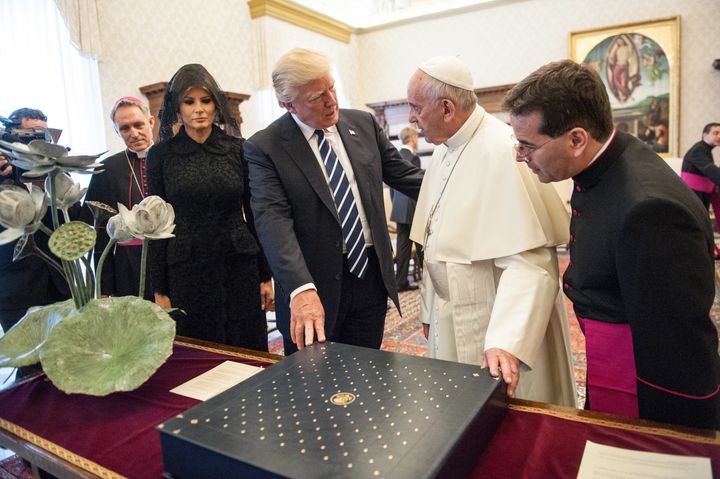 Pope Francis exchanges gifts with United States President Donald Trump and First Lady Melania Trump during an audience at the Apostolic Palace on May 24, 2017 in Vatican City, Vatican.