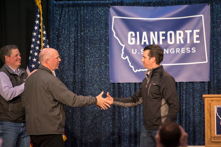 Republican Greg Gianforte, left, shakes hands with Donald Trump Jr. at a campaign event in Bozeman, Montana, in April.