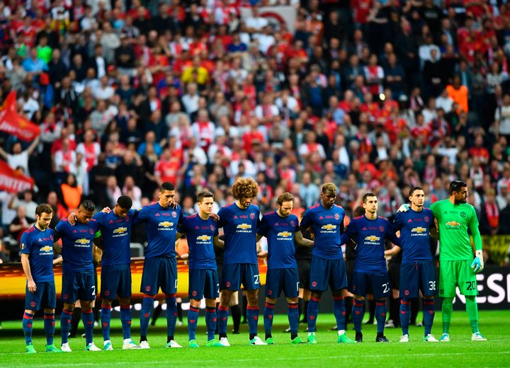 Manchester United's players observe a minute's silence for the victims of the bomb attack in Manchester ahead the UEFA Europa League final football match Ajax Amsterdam v Manchester United