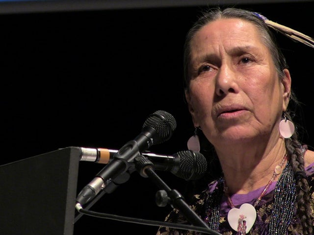 <em>Casey Camp Horinek speaks inside of the United Nations COP21 Climate Negotiations during a WECAN International event</em>