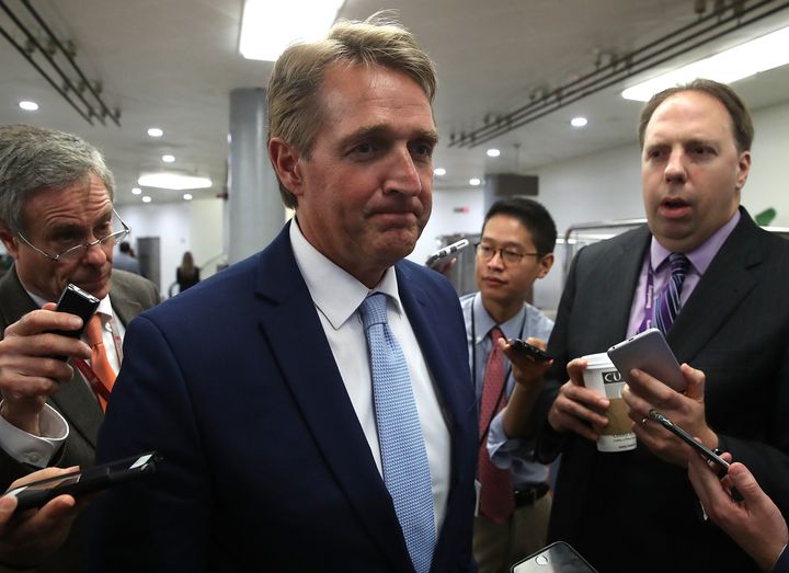 Sen. Jeff Flake (R-Ariz.) doesn't look thrilled to see reporters, but he deals with the situation like an adult.