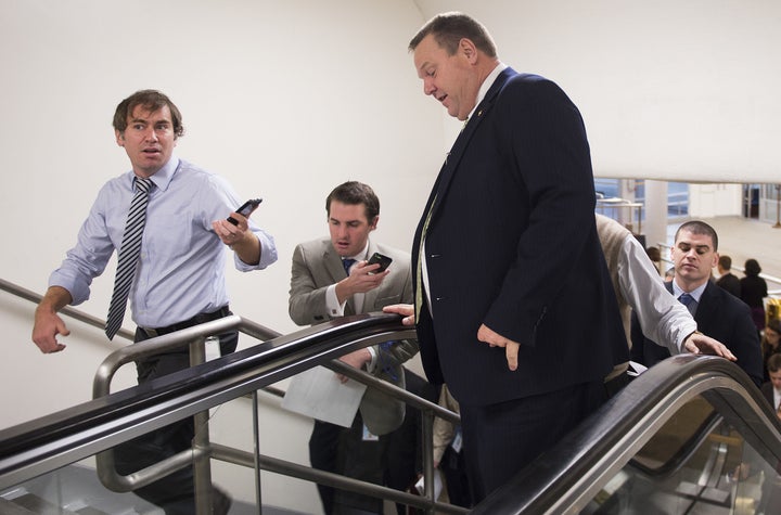 Sen. Jon Tester (D-Mont.) is able to walk up an escalator and deal with reporter questions.