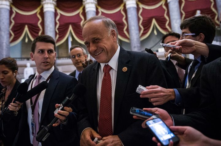 Rep. Steve King (R-Iowa) is smiling, even though reporters with recorders are nearby.
