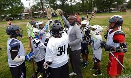 Philadelphian Arthur Johnson III (center), Springside Chestnut Hill Academy lacrosse coach and founding executive director of The Re- Education Foundation - TREF, uses sport as a tool to educate, empower and transform lives. Pictured during last weekend’s Philly Lacrosse Festival, Johnson organized friendly games between teams from locations throughout the Mid-Atlantic region.