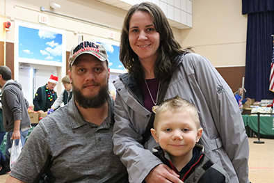 James and Stefanie Poggi with their son at the Hines VA food pantry in December.