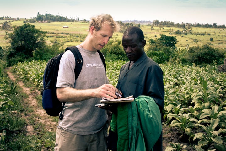 Jake Harriman talks to agriculture field manager James Magaigwa Chacha in Kenya. Nuru's development projects are locally owned and operated.