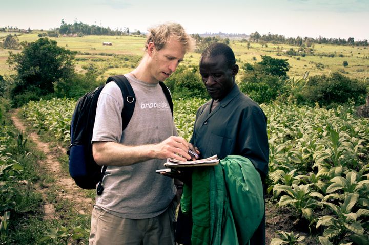 Jake Harriman talks to agriculture field manager James Magaigwa Chacha in Kenya. Nuru's development projects are locally owned and operated.