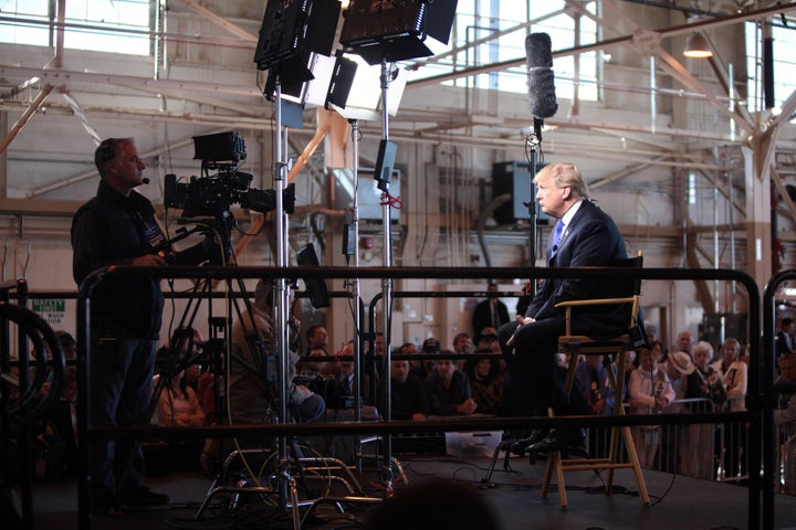 Donald Trump speaking with the media at a hangar at Mesa Gateway Airport in Mesa, Arizona.