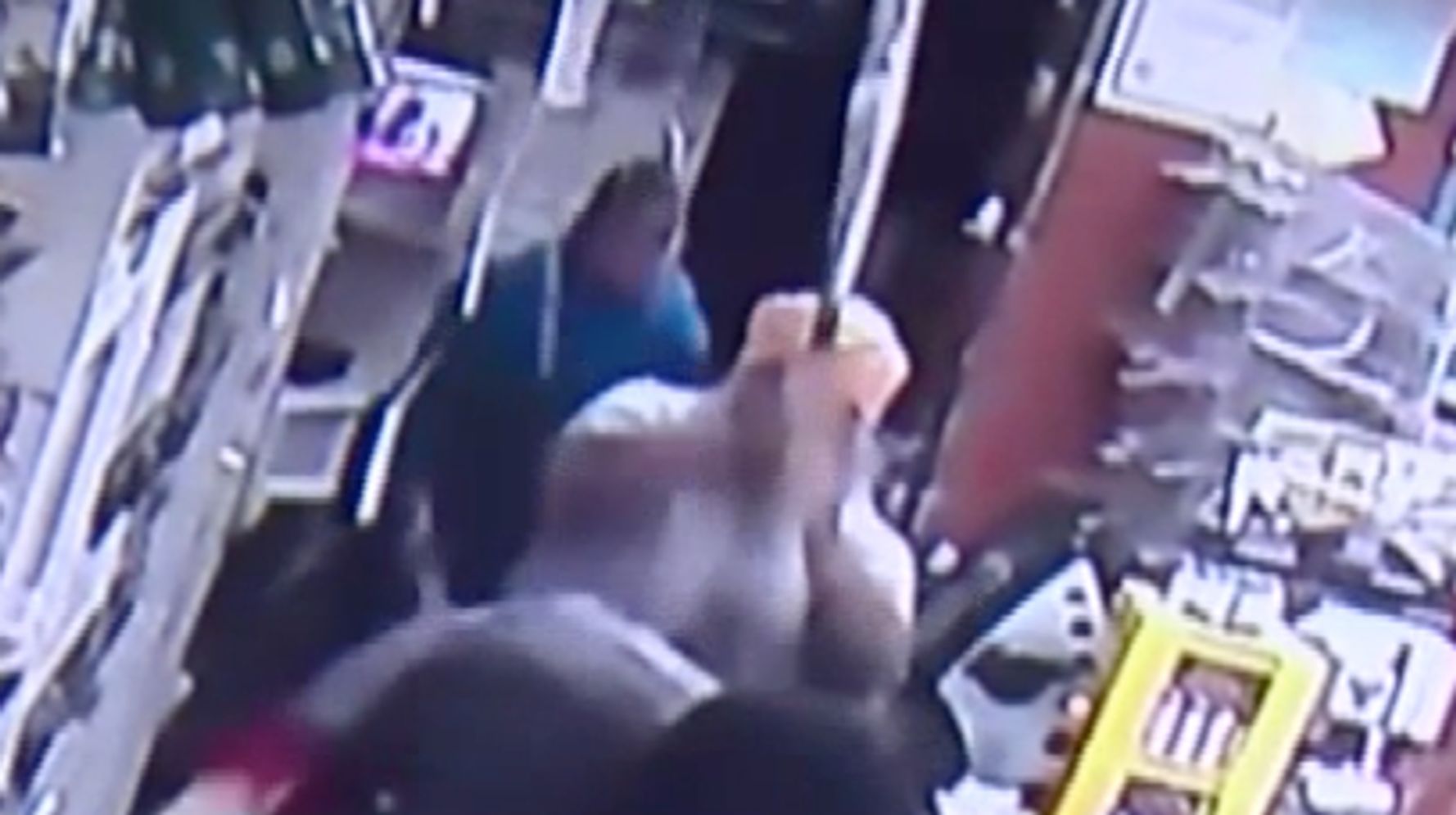 Convenience store owner fights off robber with baseball bat