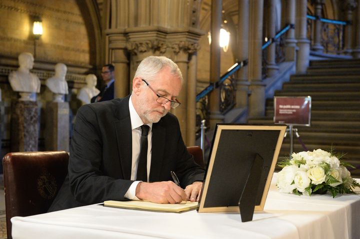 Jeremy Corbyn signs the book of condolence for attack victims at Manchester Town Hall.