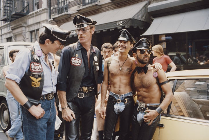 A group of men relax on the street during the Pride parade in New York City in June 1982.