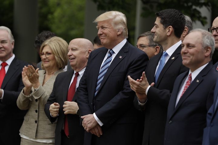 President Trump and House Speaker Paul Ryan, to his left, celebrating the House passage of the AHCA on May 4.