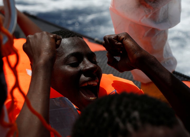 A migrant rejoices after being rescued in international waters off the Libyan coastline on March 4, 2017. Almost 363,000 people arrived in Italy by sea last year.