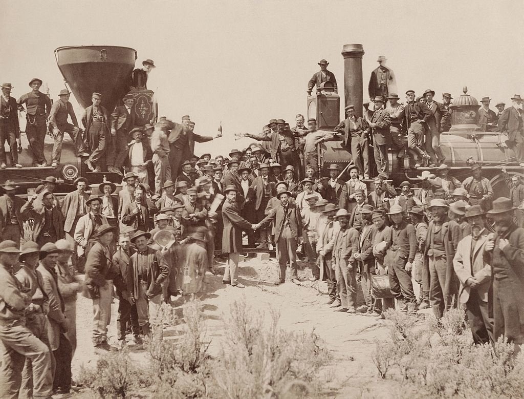 A.J. Russell image of the celebration following the driving of the "Last Spike" at Promontory Summit, Utah, May 10, 1869. Because of temperance feelings the liquor bottles held in the center of the picture were removed from some later prints.