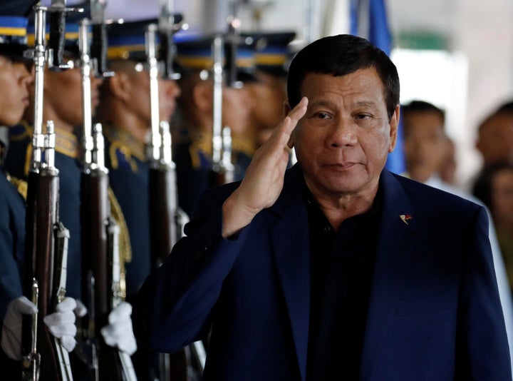 Philippine President Rodrigo Duterte salutes the honor guards upon arrival from Russia at the Ninoy Aquino International airport in Paranaque, Metro Manila, Philippines May 24, 2017.