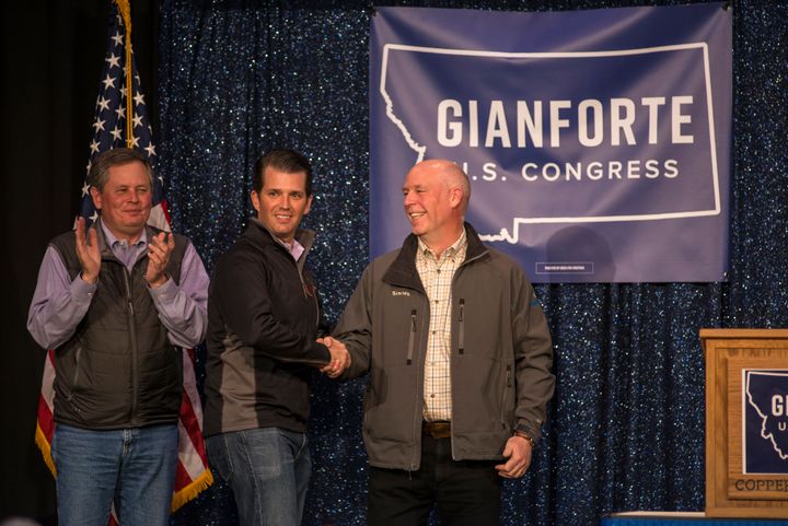President Donald Trump's eldest child, Donald Trump Jr., center, campaigns in April for Republican Greg Gianforte, right. Gianforte capitalized on the president's popularity in Montana.