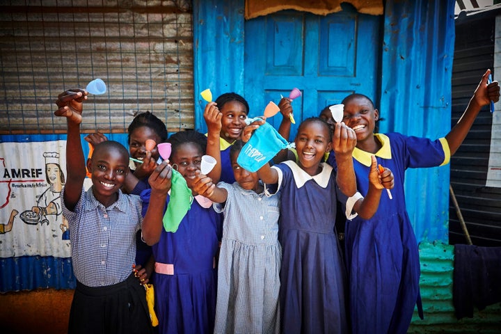 Girls in Nairobi, Kenya learning about menstrual cups with The CUP foundation.