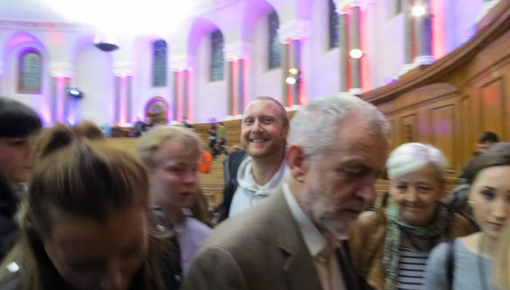 A photo posted on Daniel Ewen's Facebook page of the former local Labour vice chairman 'photo bombing' Jeremy Corbyn at a rally in December.