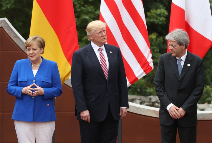 From left: German Chancellor Angela Merkel, U.S. President Donald Trump and Italian Prime Minister Paolo Gentiloni arrive for the group photo at the G-7 Taormina summit on the island of Sicily on May 26, 2017.