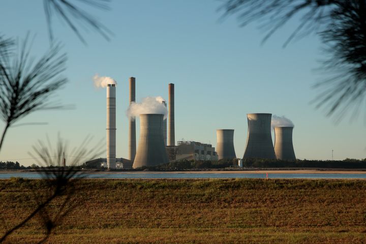 Rising temperatures -- caused by coal-fired power plants, such as the one pictured above in Georgia, and other human activities -- could disrupt sleep around the world.