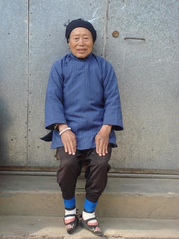 Laurel Bossen interviewed women in rural areas, like the woman above, who were born when foot-binding was still accepted. This woman has kept her feet bound. Here, she is wearing specially made embroidered shoes.