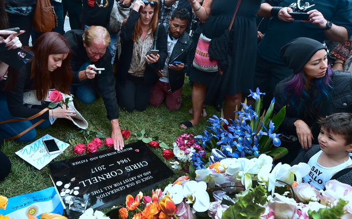 Fans visit the grave of Chris Cornell at Hollywood Forever Cemetery following a funeral service earlier in the day for the Soundgarden frontman on May 26, 2017 in Los Angeles, California.