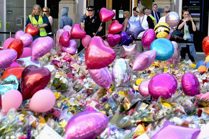 Floral tributes have been left in Manchester's St Ann's Square