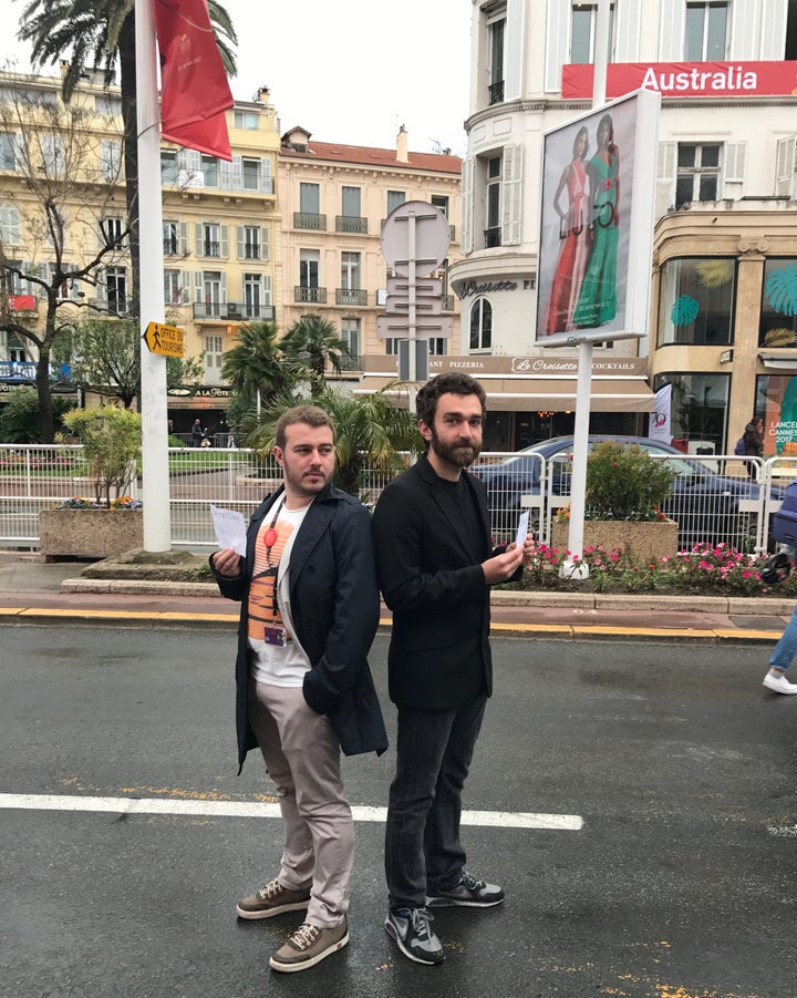 People brave the rain in the hopes of getting access to screenings