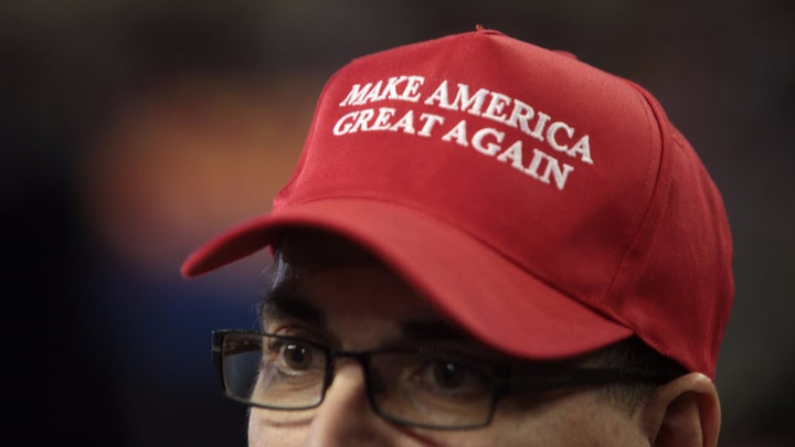 Make America Great Again hat in support of Donald Trump at a rally at Veterans Memorial Coliseum at the Arizona State Fairgrounds in Phoenix, Arizona.