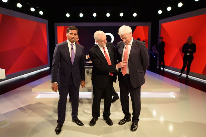 Labour leader Jeremy Corbyn adjusts the tie of Jeremy Paxman as they stand alongside Sky News political editor Faisal Islam during a joint Channel 4 and Sky News general election programme