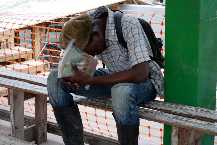 October 2011 as Cholera begins to spread in the river valleys of Haiti. This young man is weeping after obtaining a cholera treatment pack. Adding to the misery inflicted by natural disaster, the United Nations contingent from Nepal introduced cholera into the water system, leaving up to 10,000 dead and hundreds of thousands sickened. The numbers are still rising and cholera is in Haiti to stay. In the first five weeks of 2017 a total of 1,897 cholera cases were reported in Haiti, including 28 deaths. 