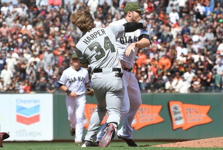 Washington Nationals outfielder Bryce Harper connects with a punch after San Francisco Giants pitcher Hunter Strickland hit him with a pitch.