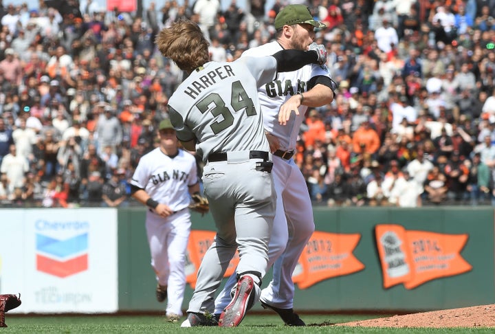 Washington Nationals outfielder Bryce Harper connects with a punch after San Francisco Giants pitcher Hunter Strickland hit him with a pitch.