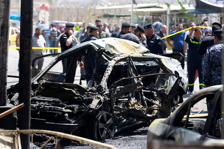 A wreckage of a car is seen at the site of car bomb attack near a government office in Karkh district in Baghdad.