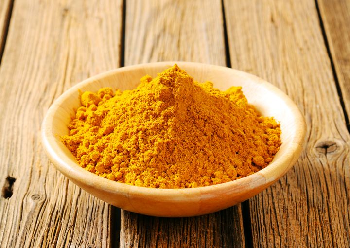 A bright yellow heap of curry powder.