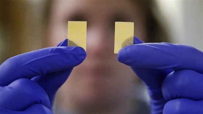 <p>An investigator with the New Hampshire Department of Corrections shows Suboxone strips found in a smuggling attempt. The state recently banned kissing between inmates and visitors and removed board games and vending machines from visiting rooms in an attempt to stop the flow of drugs.</p>