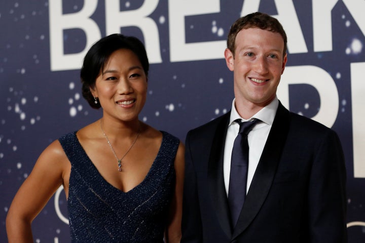 Mark Zuckerberg (R), founder and CEO of Facebook, and wife Priscilla Chan.