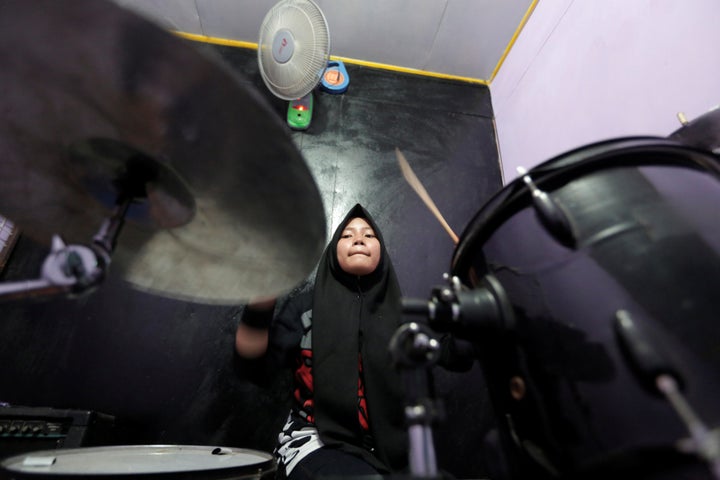 Euis Siti Aisyah, a member of the metal Hijab band Voice of Baceprot, practices at a studio before she performs in Garut, Indonesia, May 14, 2017.