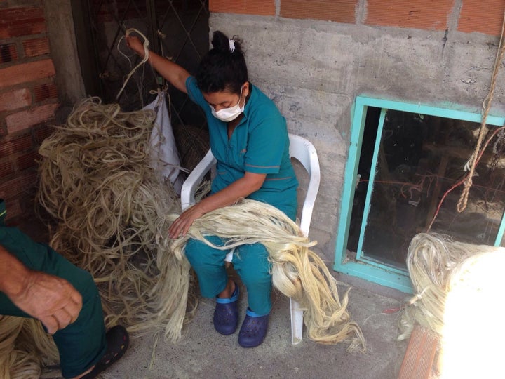 The artisans handle the fique fibers. 