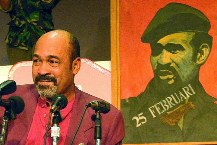 Surinamese’s President Desi Bouterse in 1996, speaking in front of a portrait of himself from back in his military strongman days. 