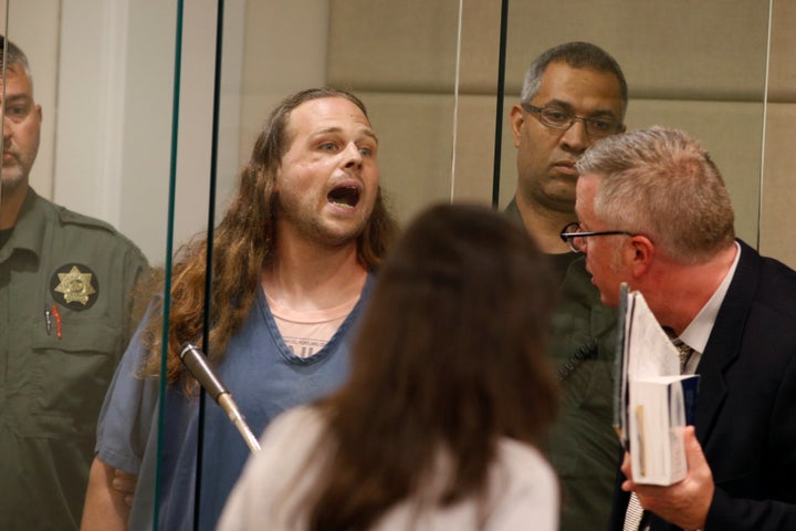 Jeremy Christian yells as he awaits his Tuesday arraignment.