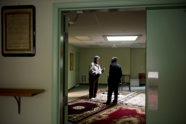 Imam Mikal Shabazz, right, and his brother Omar Shabazz, right, talk at the Muslim Community Center of Portland on May 30, 2017.