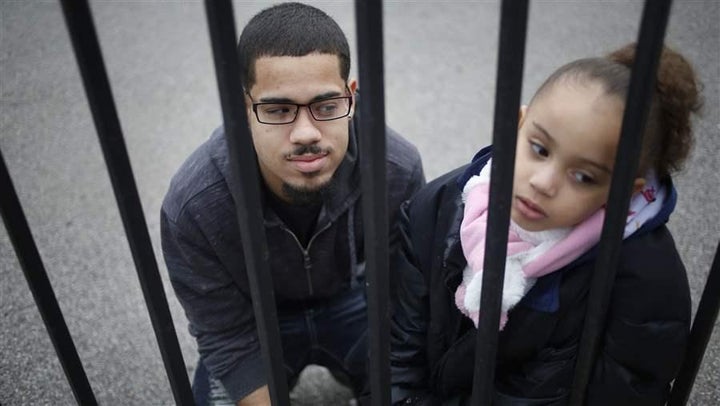 Luis Padilla with his daughter, Isabella, near their home in New York. Padilla was arrested at 16 and sent to Rikers Island.