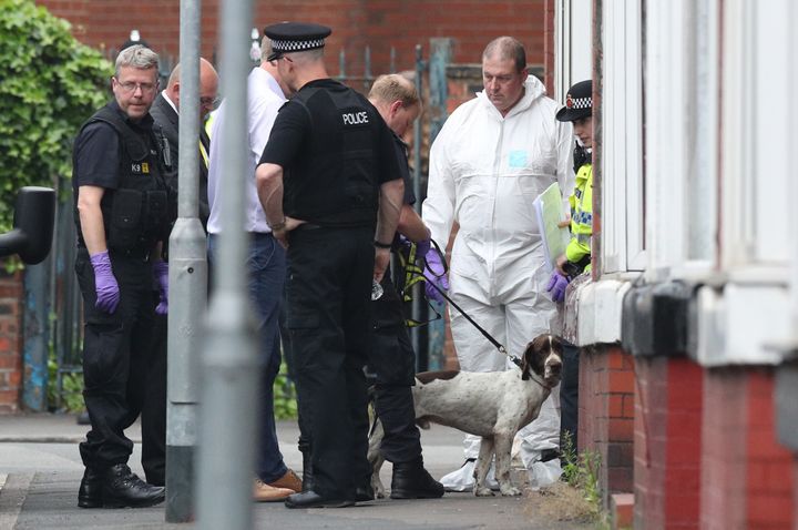 Police are continuing to search an address at Banff Road in Rusholme and have 11 men in custody