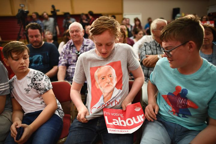 A young Labour Party supporter shows off his Jeremy Corbyn T-shirt before Corbyn's election campaign speech in Basildon, England, on June 1, 2017.