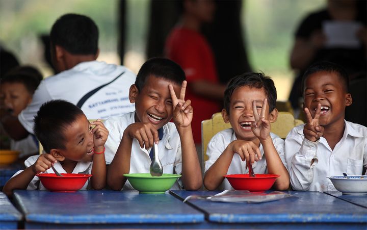 Caring for Cambodia (CFC) provides a “Food for Thought” program where children and their families who drop them off at schools can enjoy breakfast. Location: Spean Chreav Amelio Primary School, Siem Reap. 