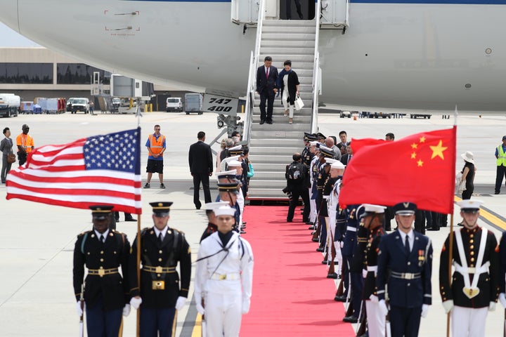 Chinese President Xi Jinping and first lady Peng Liyuan arrive at Palm Beach International Airport April 6, 2017 in West Palm Beach, Florida. (Photo by Joe Raedle/Getty Images)