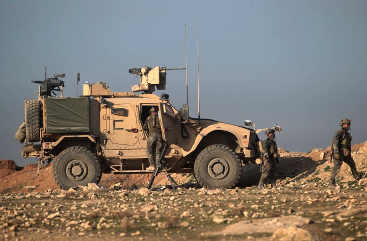 U.S. special forces monitor as Iraqi forces advance on February 23, 2017 towards Mosul airport.