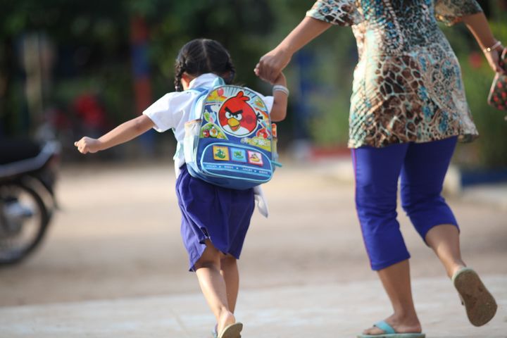 Some parents who live closer to school walk their children to school. Location: Spean Chreav Amelio Primary School, Siem Reap.
