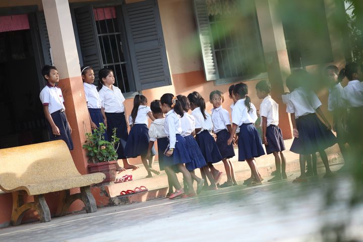Students lining up outside of school to enter their classrooms. Location: Spean Chreav Amelio Primary School, Siem Reap. 